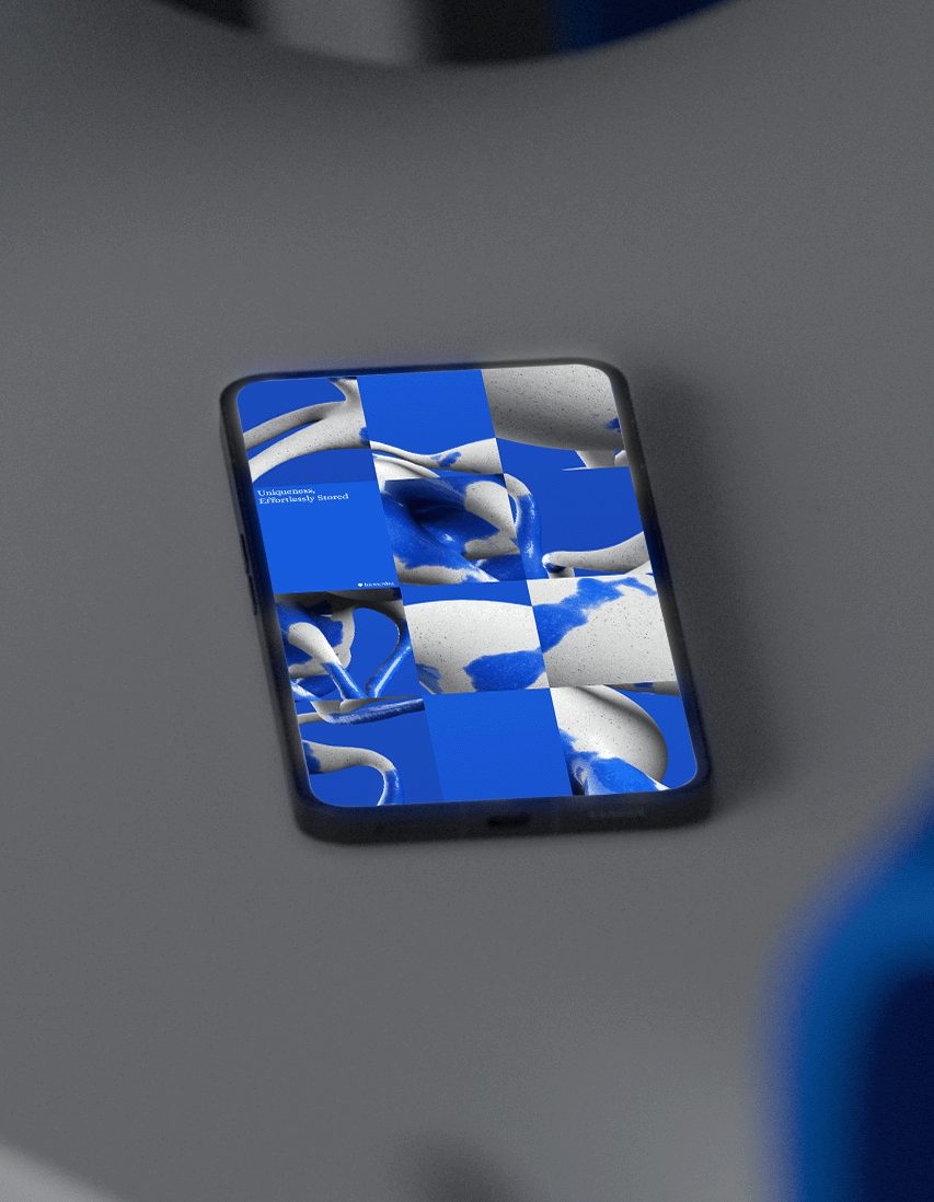 smartphone mockup with the tile-grid motif as an app screen, lying on a grey surface